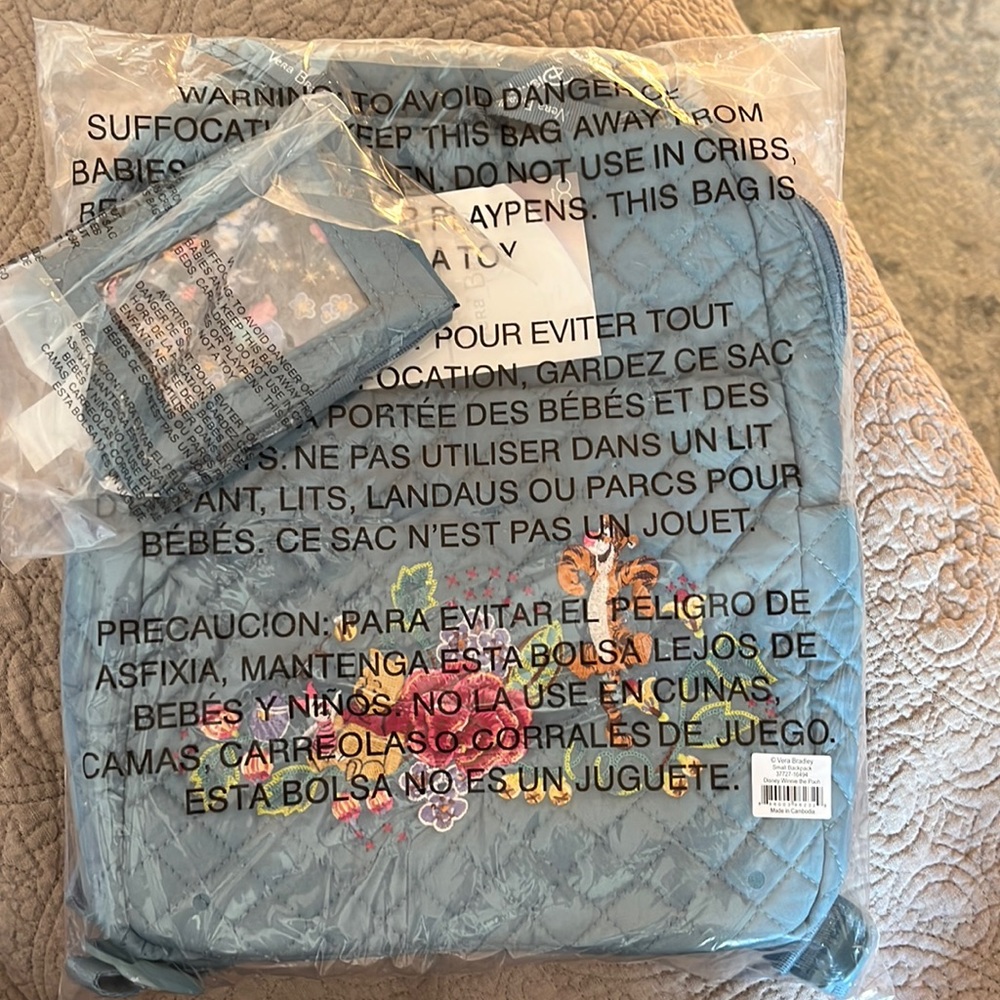 Brand new small Winnie the Pooh backpack and Zip ID case